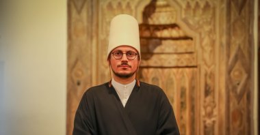 Abdurrahman Tevruz in his whirling dervish garb, in Istanbul, Türkiye, Dec. 8, 2022. (Photo by Muhammed Uzun) 