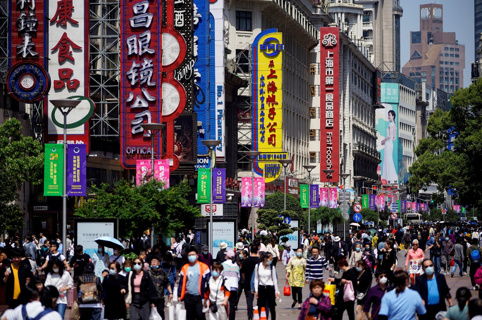 People walk along Nanjing Pedestrian Road, a main shopping area, in Shanghai, China, May 5, 2021. (Reuters Photo)