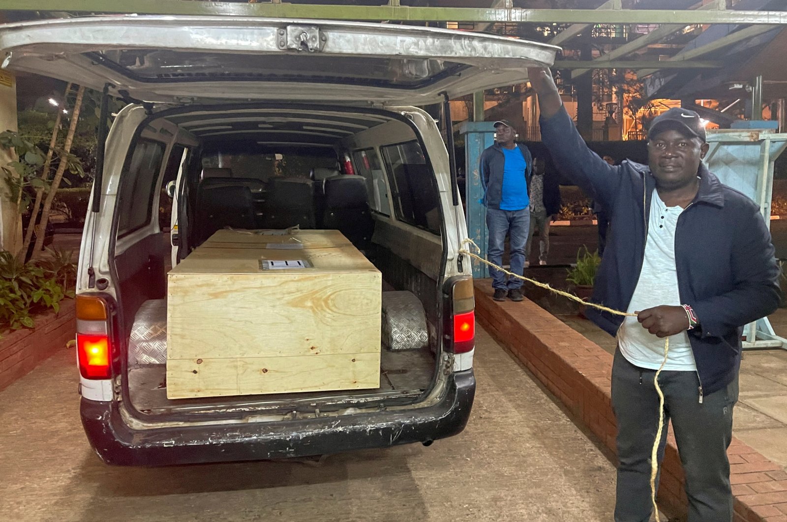 The wooden coffin containing the body of Pakistani journalist Arshad Sharif, who was shot dead when police hunting car thieves opened fire on the vehicle he was traveling in as it drove through their roadblock without stopping, is loaded into a courtesy van at the Chiromo mortuary in Nairobi, Kenya, Oct. 24, 2022. (Reuters File Photo)