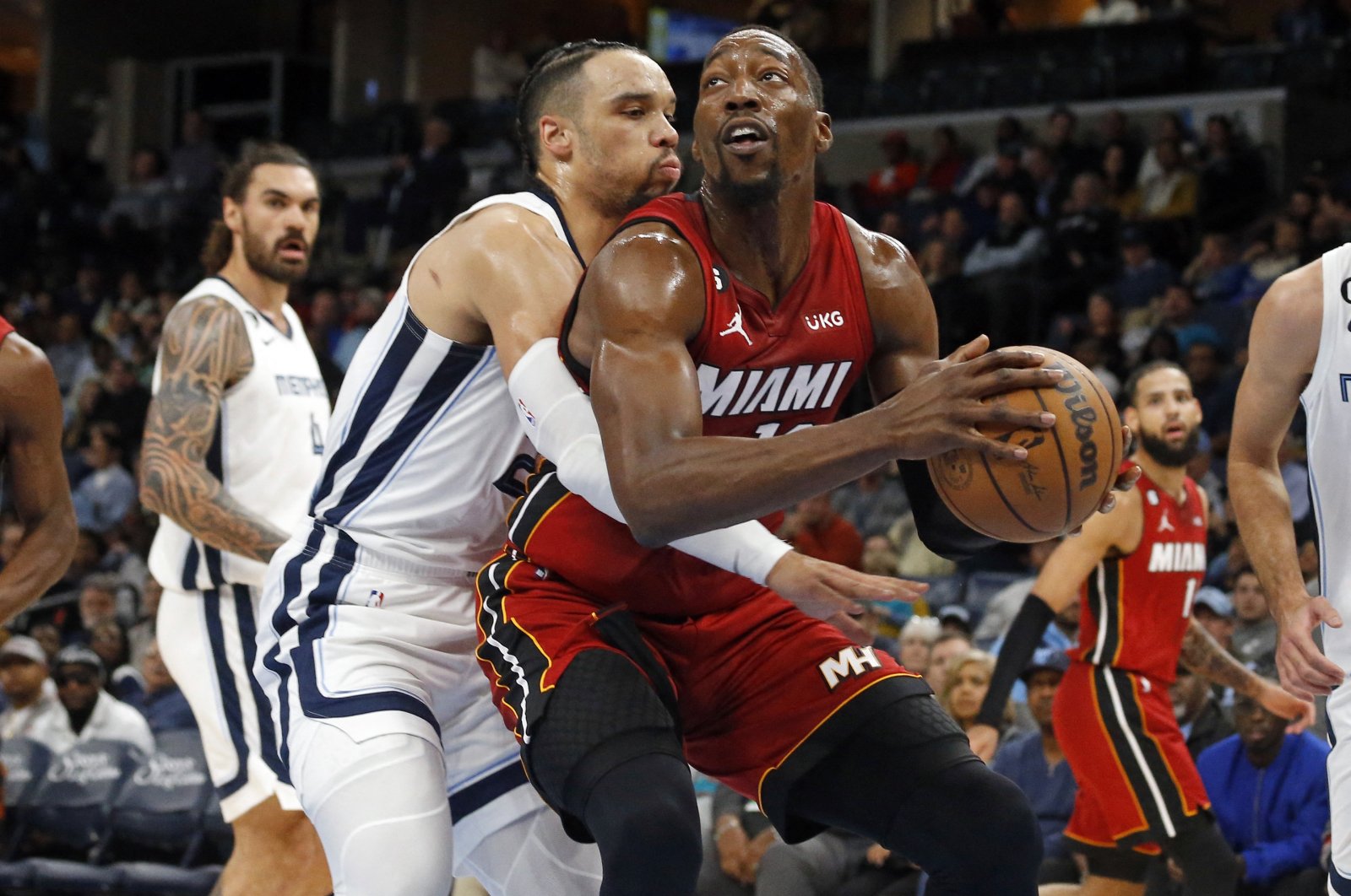 Miami Heat center Bam Adebayo drives to the basket as Memphis Grizzlies forward Dillon Brooks defends during the first half at FedExForum, Memphis, Tennessee, U.S., Dec. 5, 2022. (Reuters Photo)