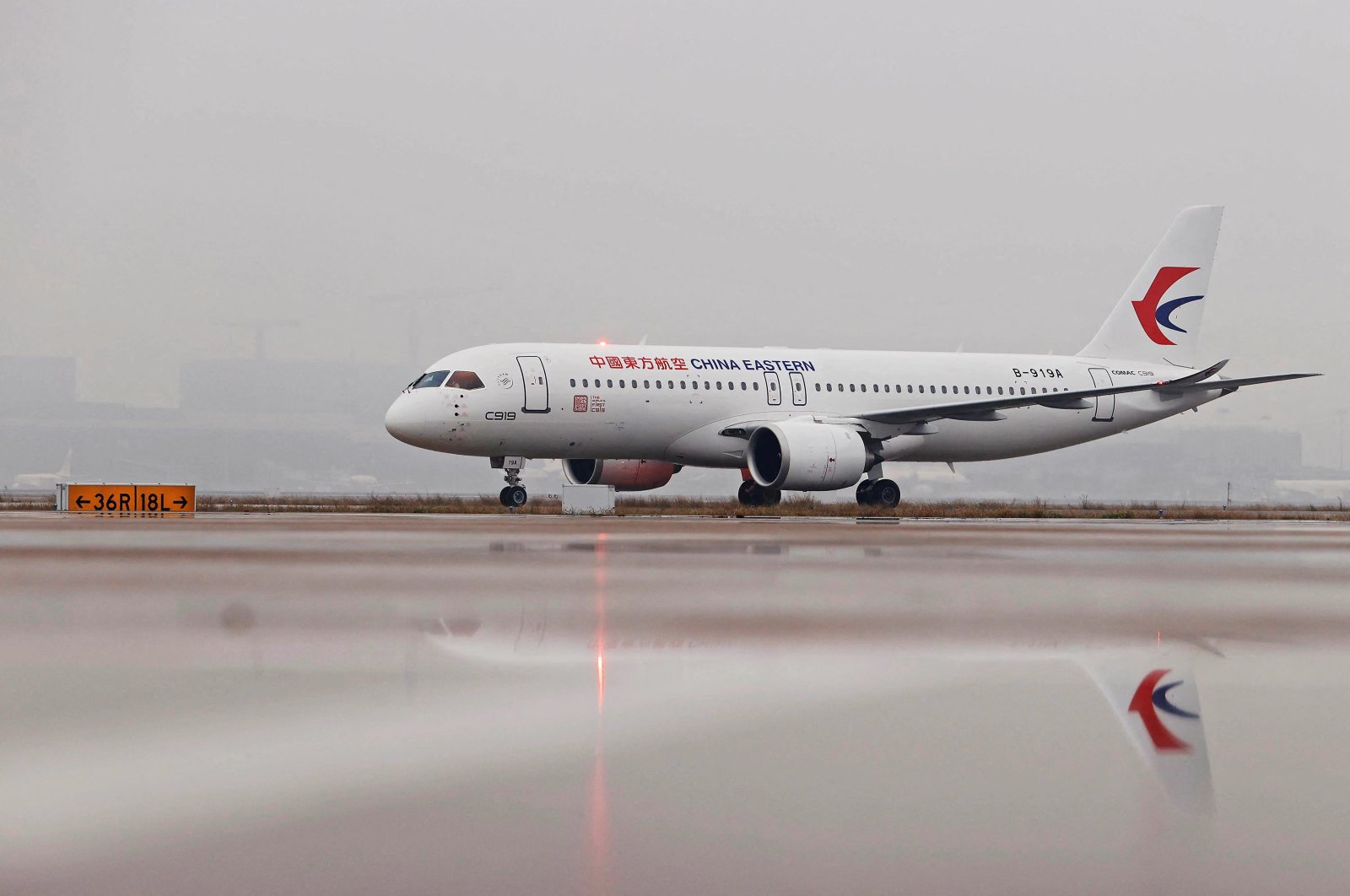 The C919 aircraft, China&#039;s first domestically produced large passenger jet, lands at Hongqiao International Airport after it is formally handed over to China Eastern Airlines in Shanghai, China, Dec. 9, 2022. (AFP Photo)