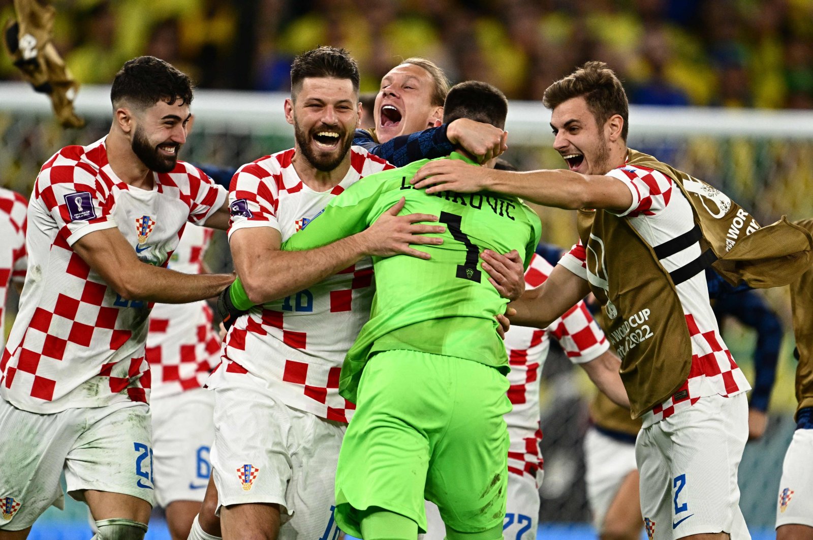 Croatia&#039;s goalkeeper Dominik Livakovic and teammates celebrate after qualifying for the next round after defeating Brazil in the penalty shoot-out of the Qatar 2022 World Cup quarter-final football match between Croatia and Brazil at Education City Stadium in Al-Rayyan, west of Doha, Qatar, Dec. 9, 2022. (AFP Photo)