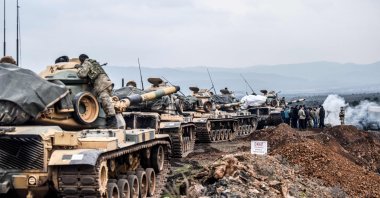 In this file photo taken on January 21, 2018, Turkish army troops gather near the Syrian border at Hassa, in Hatay province. (AFP Photo)