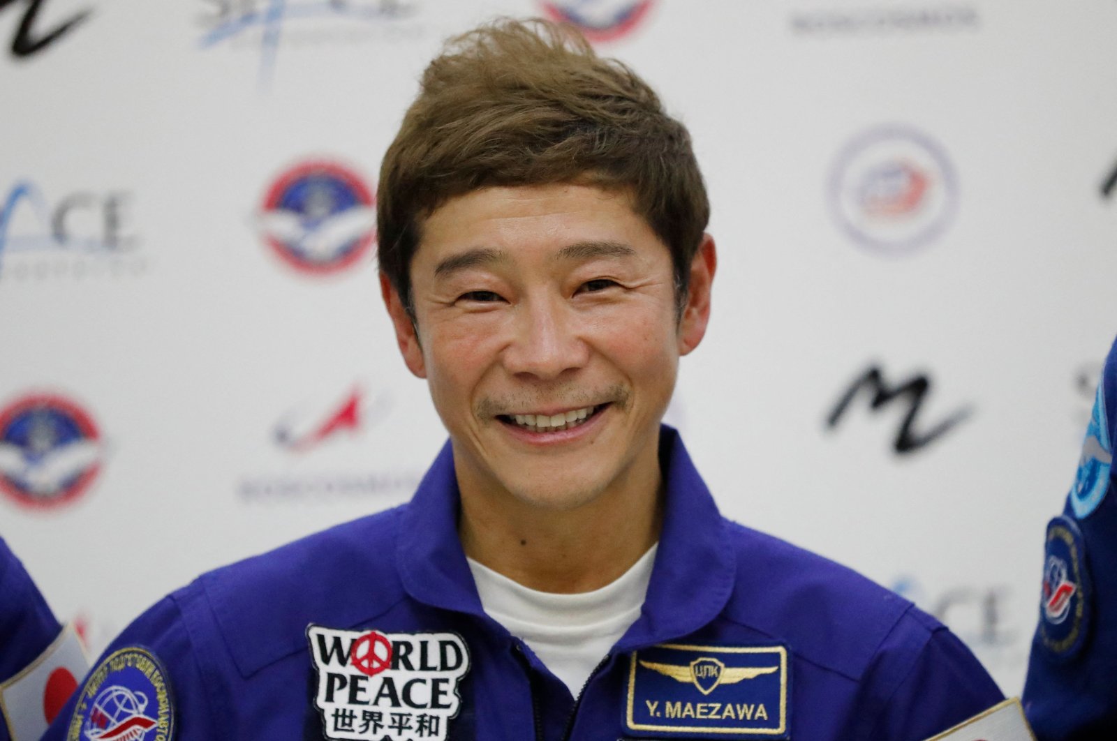 Space flight participant, Japanese billionaire Yusaku Maezawa attends a press conference ahead of the expedition to the International Space Station, in Star City outside Moscow, Russia, Oct. 14, 2021. (AFP Photo)