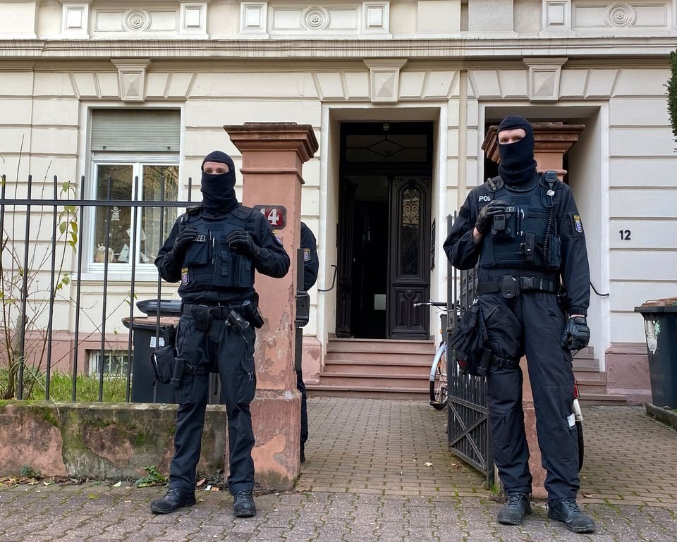 Police secures the area after 25 suspected members and supporters of a far-right group, that the interior ministry claimed posed a terrorist threat, were detained during raids across Germany, in Frankfurt, Germany, Dec. 7, 2022. (Reuters Photo)