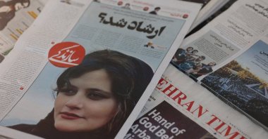 A newspaper with a cover picture of Mahsa Amini, a woman who died after being arrested by Iranian morality police, Tehran, Iran, Sept. 18, 2022. (Reuters Photo)