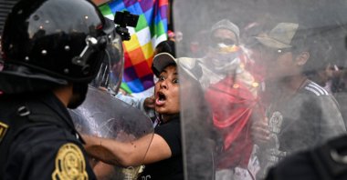 Supporters of former President Pedro Castillo clash with riot police during a demonstration, Lima, Peru, Dec. 11, 2022. (AFP Photo)
