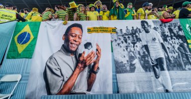 Brazil fans show their support with a banner depicting former Brazil player Pele during the FIFA World Cup Qatar 2022 Round of 16 match between Brazil and South Korea at Stadium 974, Doha, Qatar, Dec. 5, 2022. (Getty Images Photo)