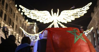 Moroccan fans celebrate on Regent Street after the World Cup quarterfinal match between Morocco and Portugal in London, England, Dec. 10, 2022. (AP Photo)