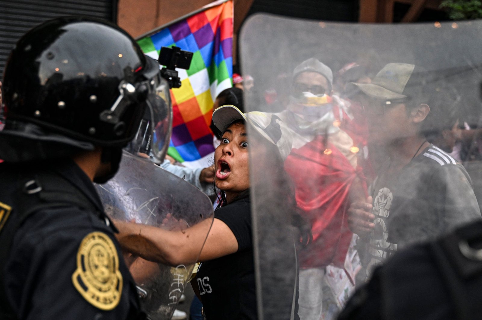 Supporters of former President Pedro Castillo clash with riot police during a demonstration, Lima, Peru, Dec. 11, 2022. (AFP Photo)