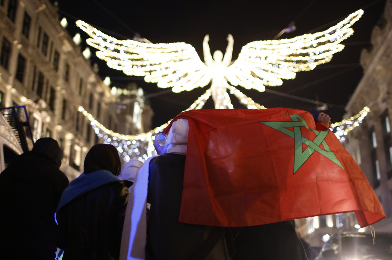 Moroccan fans celebrate on Regent Street after the World Cup quarterfinal match between Morocco and Portugal in London, England, Dec. 10, 2022. (AP Photo)