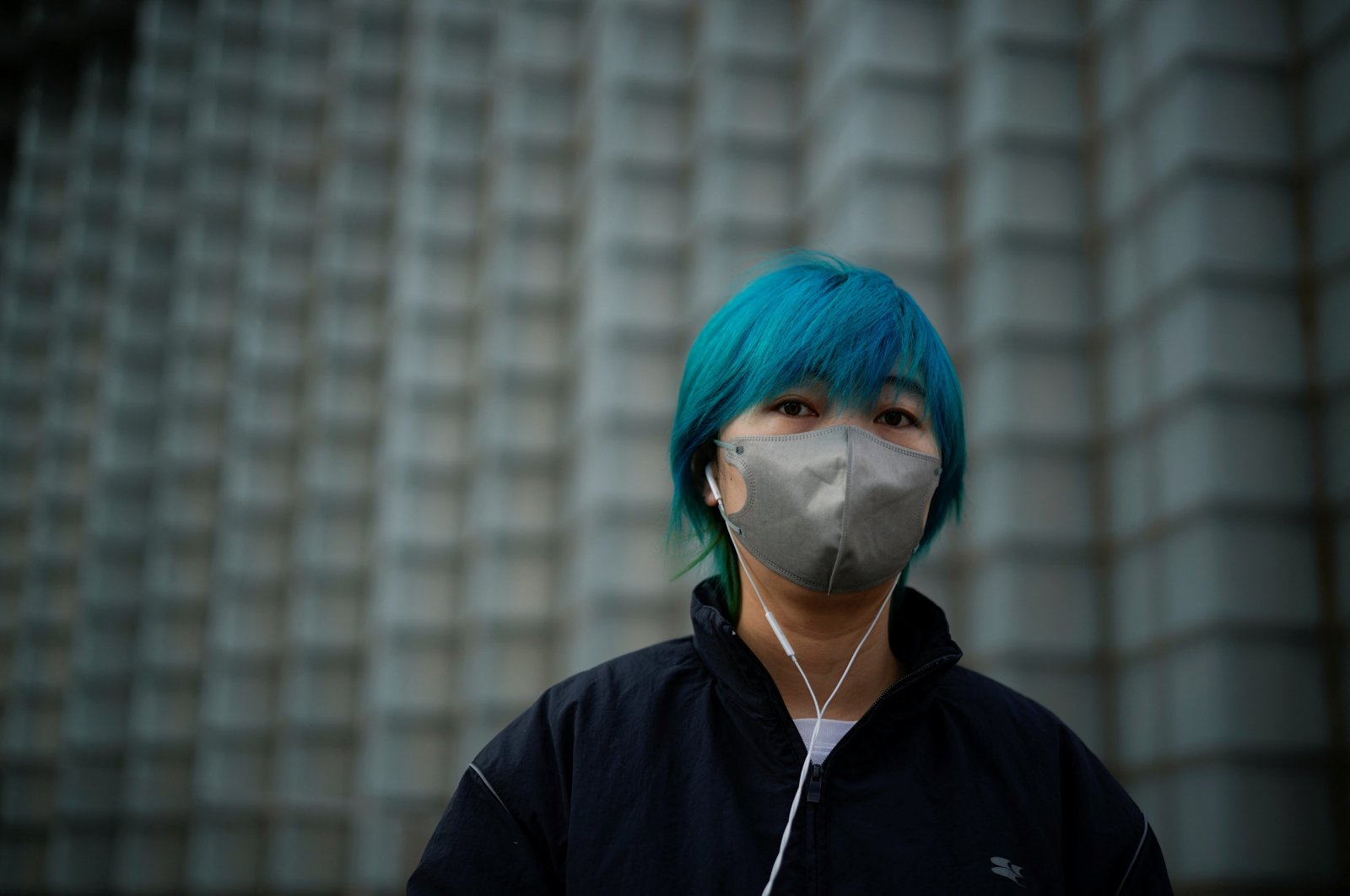 A woman wearing a face mask walks on the street, as coronavirus disease (COVID-19) outbreaks continue in Shanghai, China, Dec.12, 2022. (Reuters Photo)