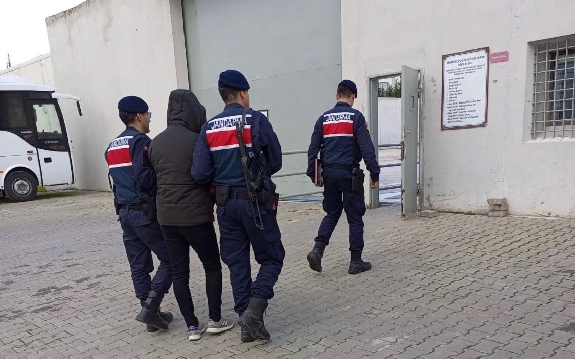 Gendarmerie officers escort a captured FETÖ suspect, in Manisa, western Türkiye, Dec. 12, 2022. (İHA Photo) 