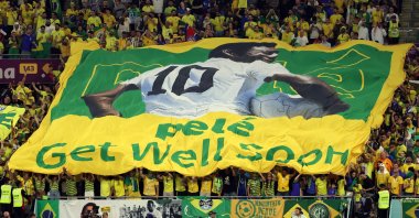 Fans of Brazil show a banner with which they wish Pele all the best during the FIFA World Cup 2022 round of 16 soccer match between Brazil and South Korea at Stadium 974, Doha, Qatar, Dec. 5, 2022. (EPA Photo)