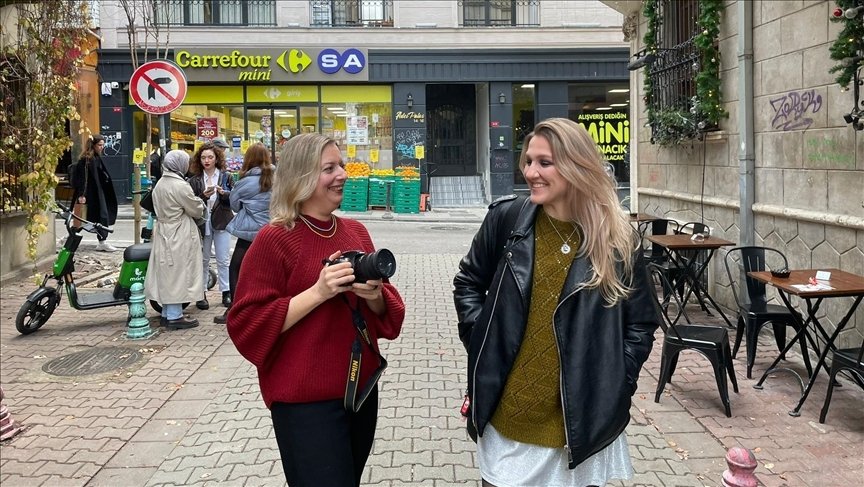 Valentina Moiseyeva (L) and Alexandra Karaseva (R) walk on a street in Istanbul, Türkiye, Dec. 13, 2022. (AA Photo) 