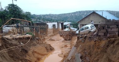 A car is seen stuck after heavy rains caused floods and landslides, on the outskirts of Kinshasa, Democratic Republic of Congo, Dec. 13, 2022. (Reuters Photo)