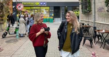 Valentina Moiseyeva (L) and Alexandra Karaseva (R) walk on a street in Istanbul, Türkiye, Dec. 13, 2022. (AA Photo) 