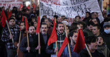 Protesters shout slogans during a demonstration, following the fatal shooting of a 16-year-old Roma teenager by police, Thessaloniki, Greece, Dec. 13, 2022. (Reuters Photo)