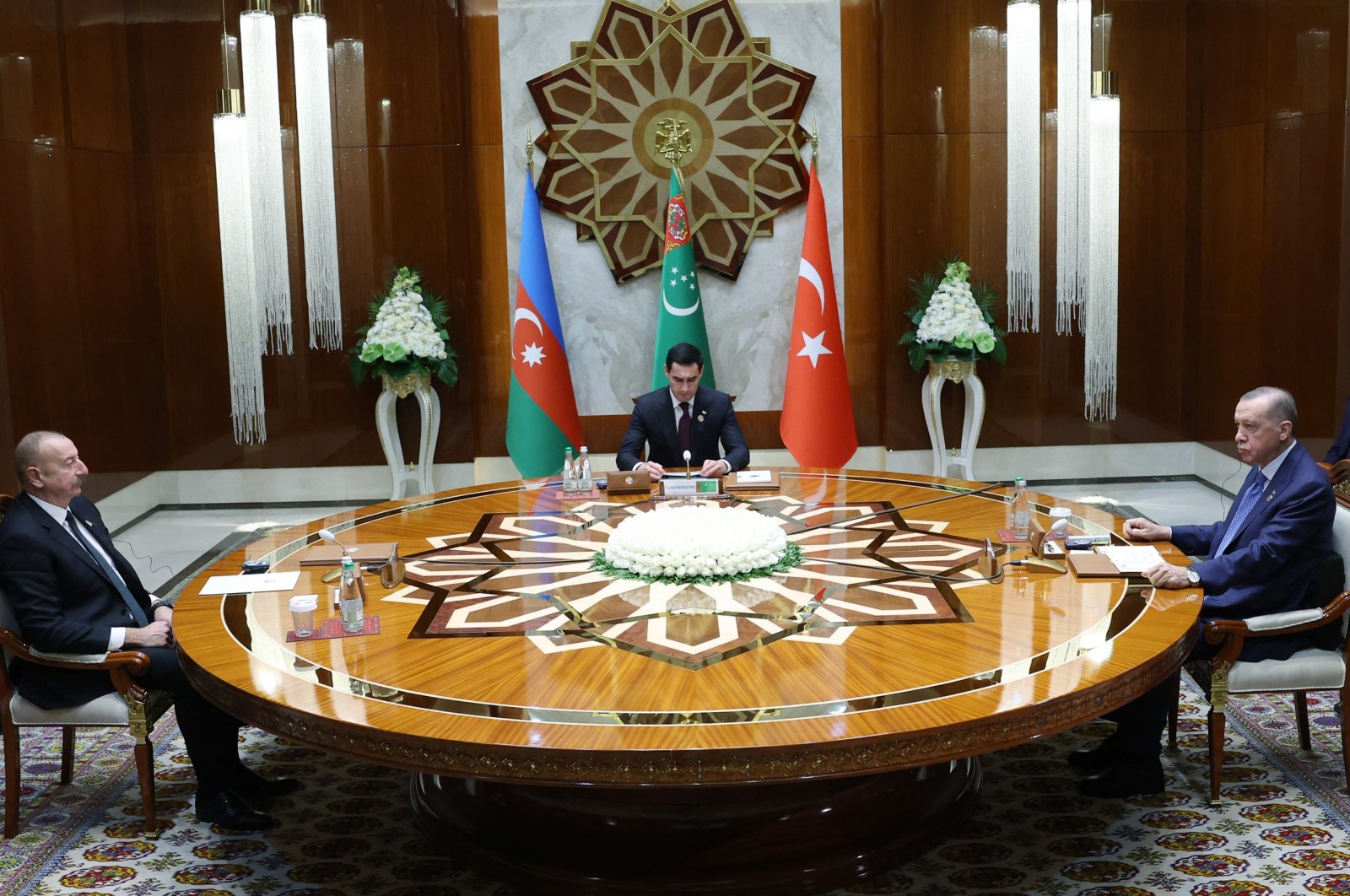 President Recep Tayyip Erdoğan (R) meeting with President of Turkmenistan Serdar Berdymukhamedov (C) and President of Azerbaijan Ilham Aliyev (L) during a trilateral summit in Awaza, Turkmenistan, Dec. 14, 2022. (Photo by Turkish Presidential Press Office via AFP)