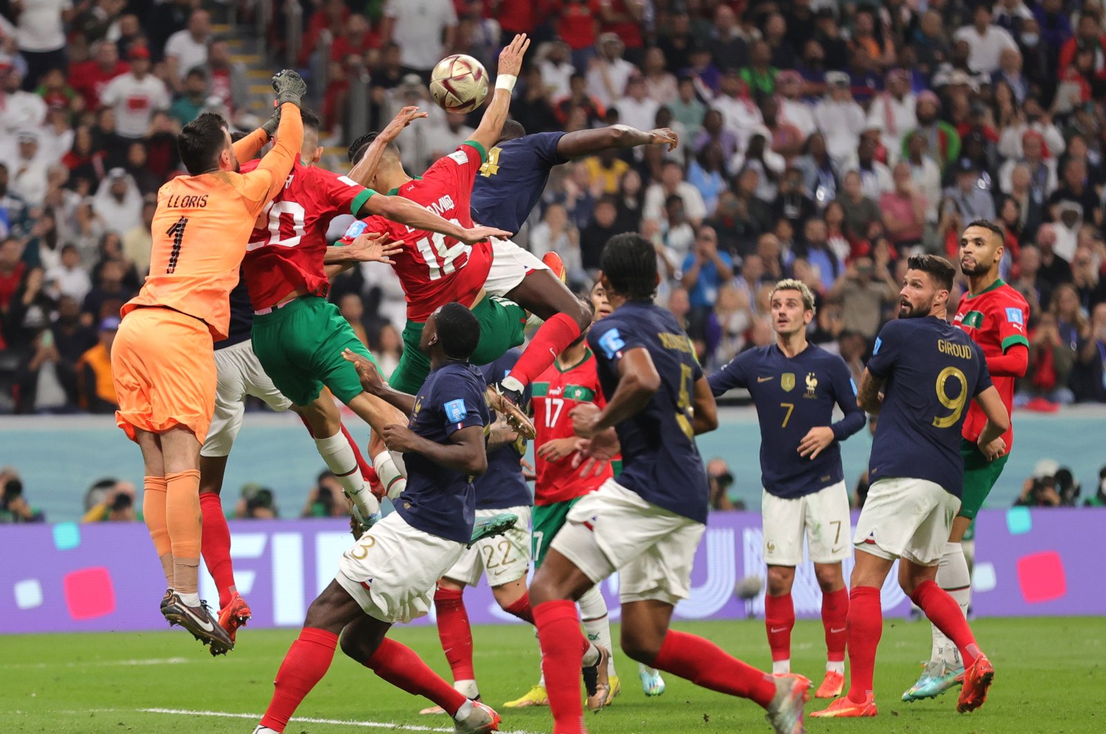 Goalkeeper Hugo Lloris (L) of France reaches for the ball during the FIFA World Cup 2022 semi-final between France and Morocco at Al Bayt Stadium in Al Khor, Qatar, Dec. 14, 2022.  (EPA Photo)