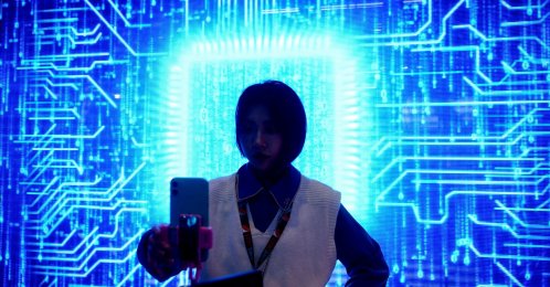 A woman visits a semiconductor device display at the Appliance and Electronics World Expo (AWE) in Shanghai, China, March 23, 2021. (Reuters File Photo)