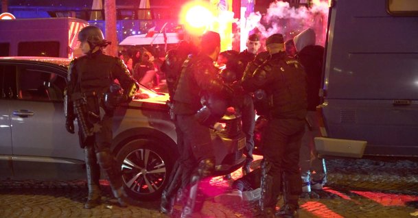 French football fans clash with police in the Champs-Elysées after France's 2-0 win over Morocco, Paris, France, Dec. 15 2022. ( AA Photo)