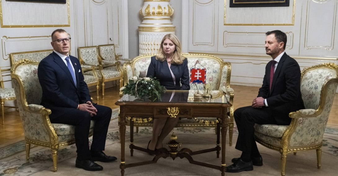 Slovakia's Prime Minister Eduard Heger (right) and House Chair Boris Kollar (left) meet Slovakia's President Zuzana Caputova, after Parliament where a vote expressed no-confidence in Heger's Government, at the Presidential Palace, in Bratislava, Thursday, Dec. 15, 2022. (AP Photo)