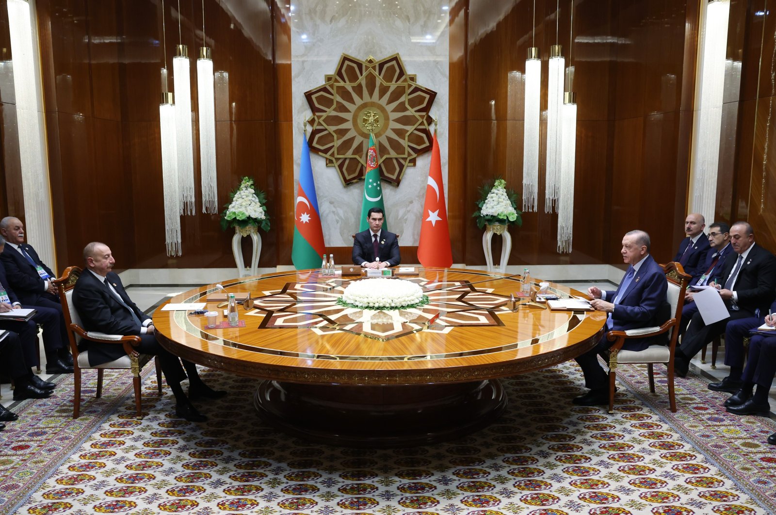 Azerbaijani President Ilham Aliyev (L), Turkmen President Serdar Berdimuhamedov (C) and President Recep Tayyip Erdoğan (R) attend a trilateral summit in Awaza, Turkmenistan, Dec. 14, 2022. (IHA Photo)