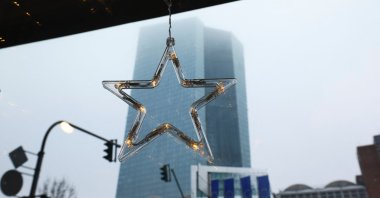 The European Central Bank building is seen from a cafe before the ECB's monthly news conference, Frankfurt, Germany, Dec. 15, 2022.