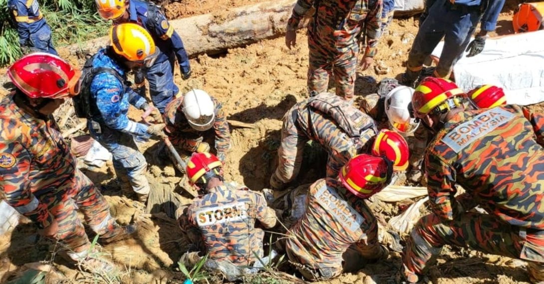 Emergency workers during a rescue and evacuation operation following a landslide at a campsite in Batang Kali, Selangor state, Malaysia, Dec. 16, 2022.