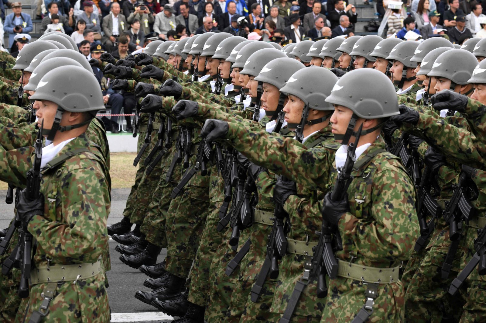 Japan Ground Self-Defense Forces taking part in a military review in Asaka, Saitama prefecture, Japan, Oct. 14, 2018. (AFP Photo)