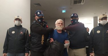 Levent Göktaş being escorted by security forces in Istanbul, Dec. 17, 2022. (DHA Photo)