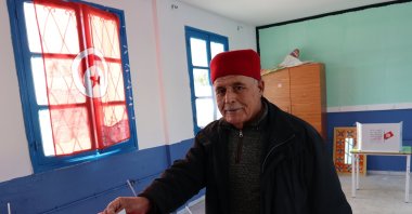 A Tunisian man casts his ballot during the first round of the Tunisian parliamentary elections, in Tunis, Tunisia, Dec. 17, 2022. (EPA Photo)