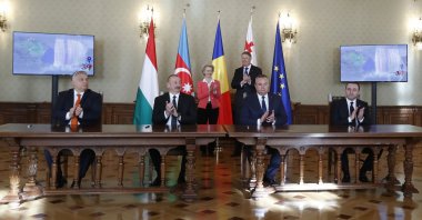 (Left to Right, front row) Hungarian Prime Minister Viktor Orban, Azerbaijan's President Ilham Aliev, Romania's Prime Minister Nicolae Ciuca and Georgia's Prime Minister Irakli Garibashvili applaud in the presence of European Commission President Ursula von der Leyen (C-L, back) and Romanian President Klaus Iohannis (C-R, back) after the signing ceremony of the Strategic Partnership Agreement for the development and transport of Green Energy between Azerbaijan, Georgia, Hungary and Romania, at Cotroceni Presidential Palace in Bucharest, Romania, Dec. 17, 2022.  (EPA Photo)