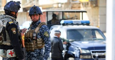 Members of the Iraqi federal police force stand guard at a checkpoint in a street in the capital during tightened security measures, Baghdad, Iraq, Jan. 29, 2021. (AFP File Photo)
