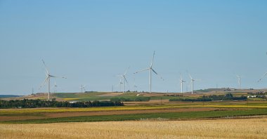 Wind turbines in the fields at sunset in Thrace (Trakya), Istanbul, Türkiye. (Shutterstock Photo)