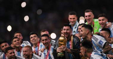 Argentina's captain Lionel Messi lifts the FIFA World Cup Trophy during the trophy ceremony after Argentina won the Qatar 2022 World Cup final football match between Argentina and France at Lusail Stadium in Lusail, north of Doha, Dec. 18, 2022. (AFP Photo)