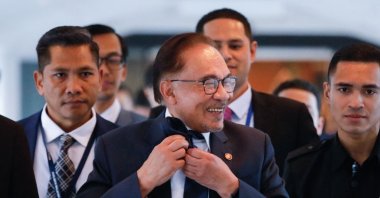 Malaysia Prime Minister Anwar Ibrahim leaves the lower house of parliament after receiving a vote of confidence, in Kuala Lumpur on Dec. 19, 2022. (AFP Photo)