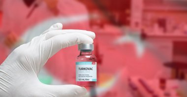 A medical professional holds a vial of the Turkuvac vaccine. (Shutterstock Photo)