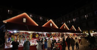 People are seen shopping at a local Christmas marketplace in Madrid, Spain, Dec. 20, 2022. (AA Photo)