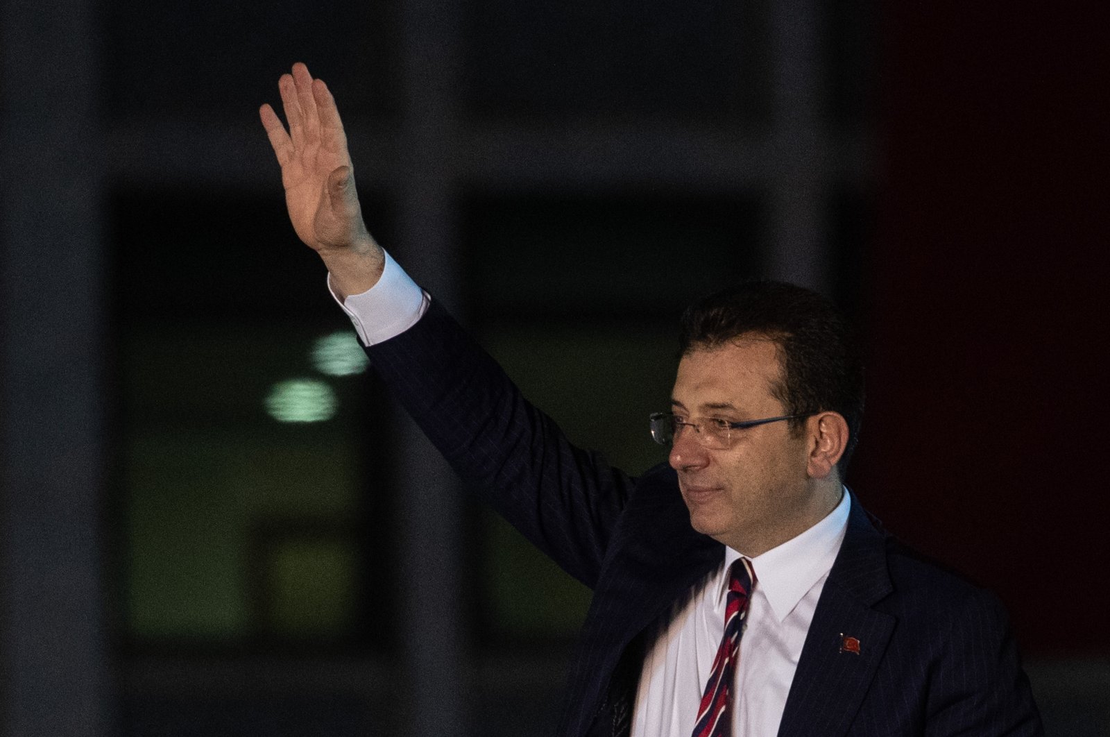 Istanbul Mayor Ekrem Imamoglu waves to the crowd in front of Istanbul Municipality building after Turkish courts verdict on Dec. 14, 2022, in Istanbul, Türkiye. (Getty Images Photo)