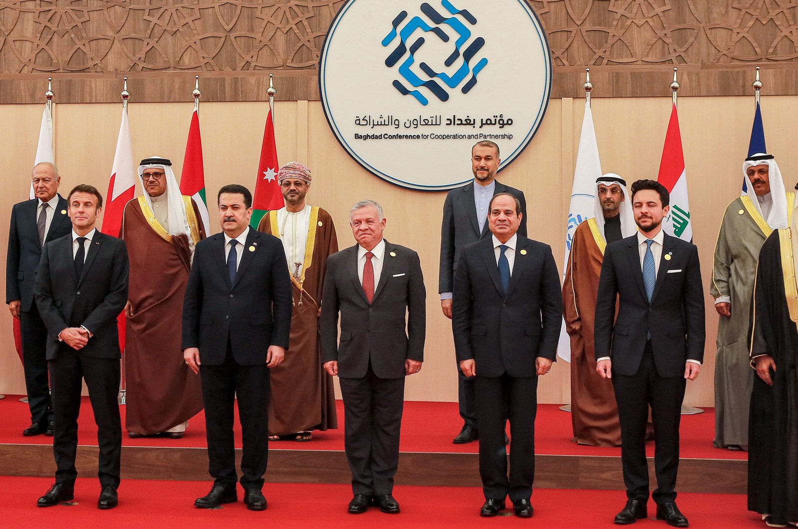(Front L to R) French President Emmanuel Macron, Iraq&#039;s Prime Minister Mohamed Shia al-Sudani, Jordan&#039;s King Abdullah, Egypt&#039;s President Abdel Fattah el-Sissi, and Jordan&#039;s Crown Prince Hussein; along with Iranian Foreign Minister Hossein Amir-Abdollahian (4th-L behind) and other dignitaries pose together in a family photo at the start of the &quot;Baghdad Conference for Cooperation and Partnership&quot; in Sweimeh, Jordan, Dec. 20, 2022. (AFP Photo)