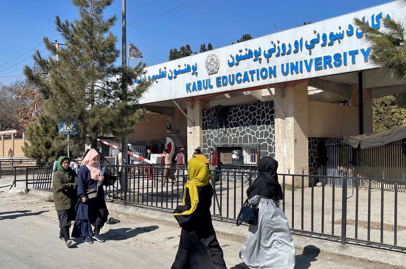 Female students walk in front of the Kabul Education University in Kabul, Afghanistan, Feb. 26, 2022. (Reuters File Photo)