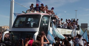 Argentinian national team players during the open top bus parade, Buenos Aires, Argentina, Dec. 2022. (EPA Photo)