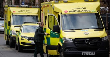 A paramedic shuts the door of an ambulance outside the Waterloo ambulance station in London, U.K., Dec. 21, 2022. (AFP Photo)