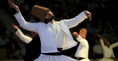 Whirling dervishes of the Mevlevi Order perform during a Şeb-i Arus ceremony in Konya, Türkiye, Dec. 17, 2022. (AP Photo)