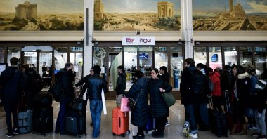 Commuters wait in line to buy tickets at the TGV Inoui shop at Gare de Lyon during a strike organized by SNCF controllers, Paris, France, Dec. 2, 2022. (AFP Photo)