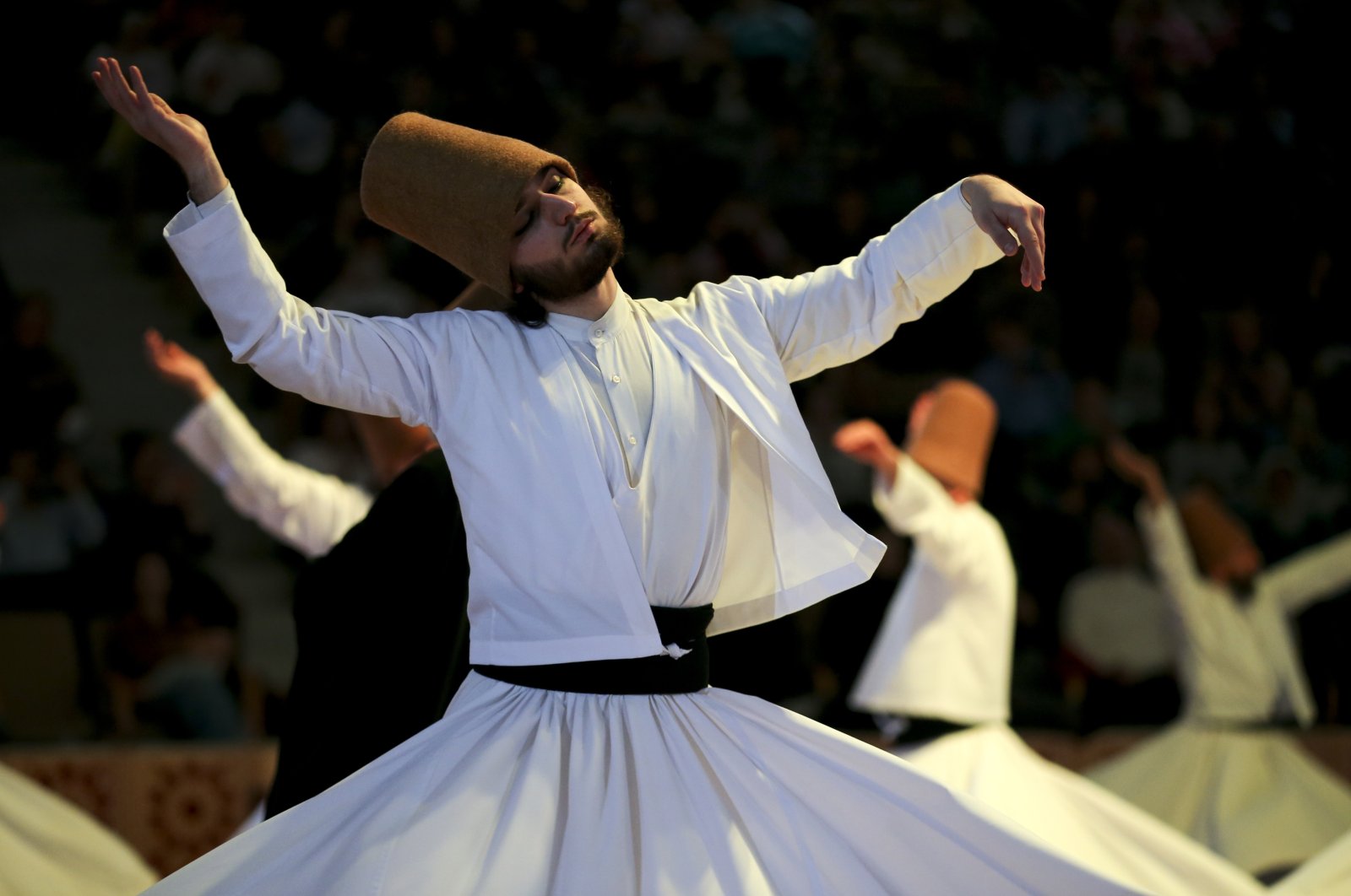 Whirling dervishes of the Mevlevi Order perform during a Şeb-i Arus ceremony in Konya, Türkiye, Dec. 17, 2022. (AP Photo)