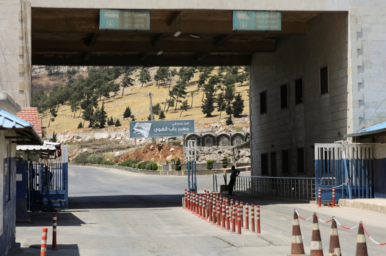 A road sign that reads "Welcome to Bab al-Hawa crossing" is seen at Bab al-Hawa crossing at the Syrian-Turkish border, in Idlib governorate, northwestern Syria, June 10, 2021. (Reuters File Photo)