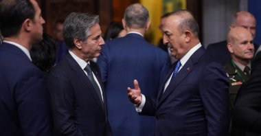 Foreign Minister Mevlüt Çavuşoğlu (R) and U.S. Secretary of State Antony Blinken (L) talk ahead of a meeting of NATO Foreign Ministers in Bucharest, Romania, Nov. 29, 2022. (AFP Photo)